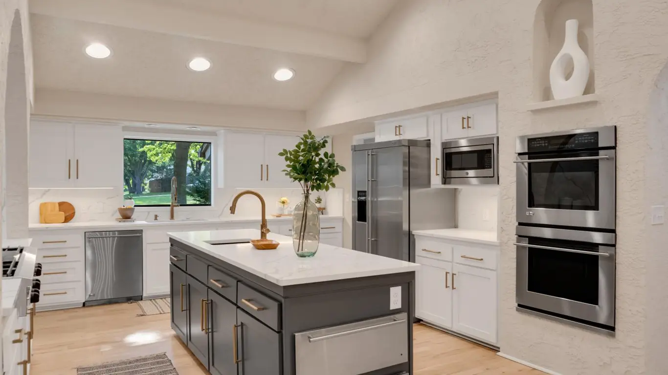 Modern kitchen remodeling in Tulsa with white cabinets, island, and custom design