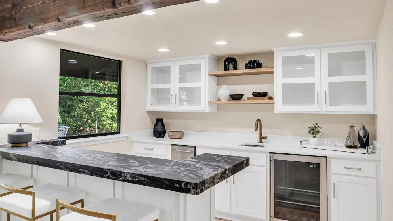 Modern kitchen remodeling in Tulsa with white cabinets, island, and custom design